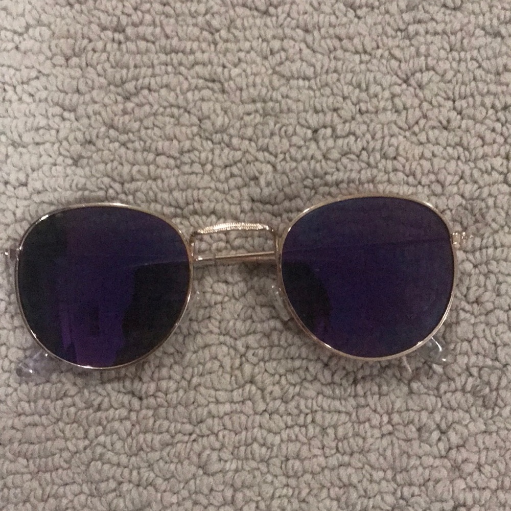purple lens gold frame sunglasses